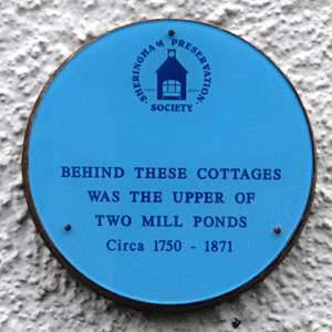 The plaque on a cottage in Beeston Road