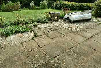 Old millstones inlaid into the mill house patio 2003